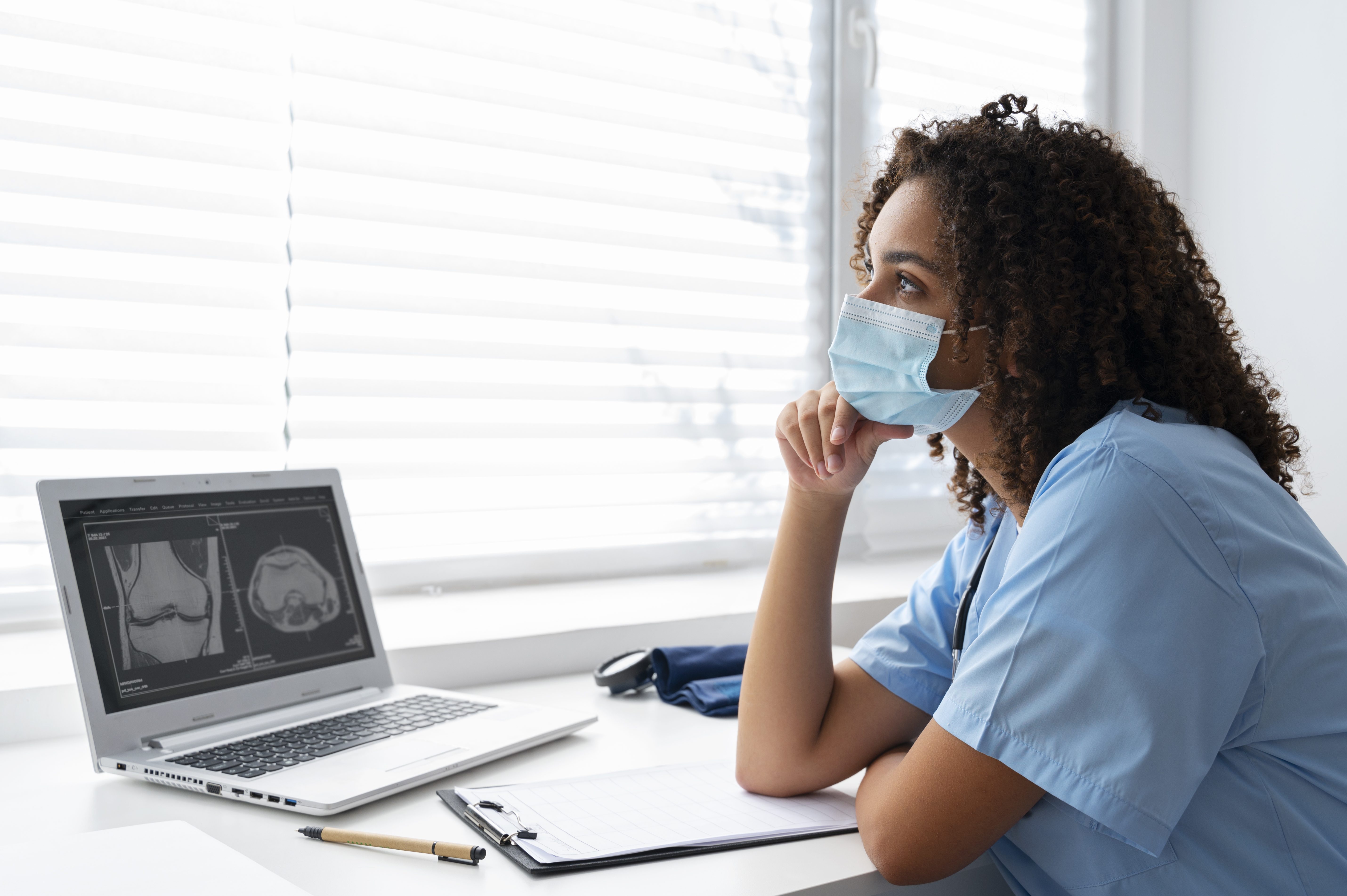 Healthcare student using digital tools for focused study and revision